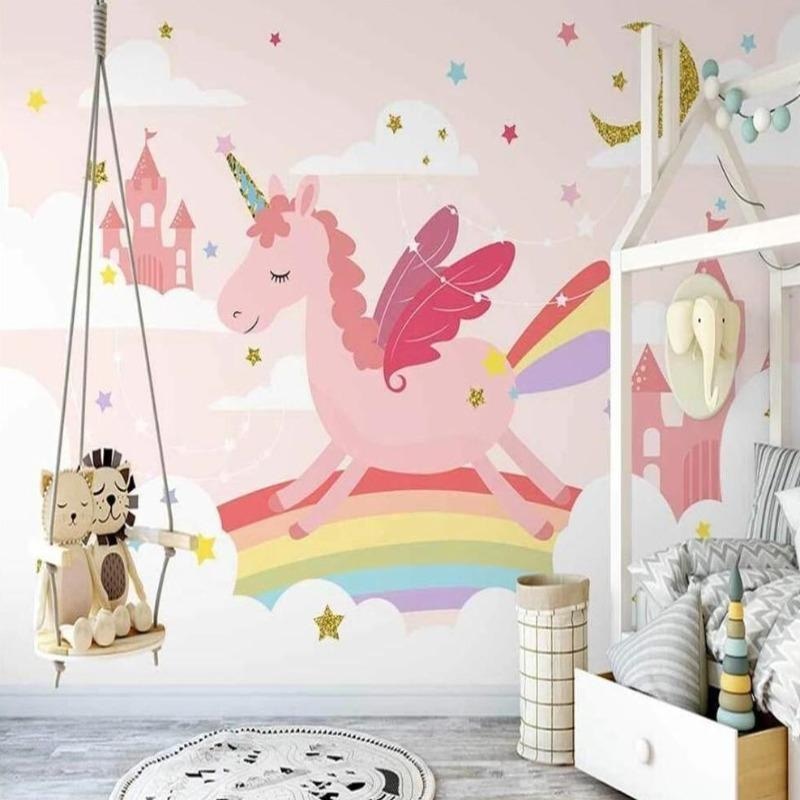 Pink unicorn wallpaper mural styled in a bright girl's bedroom with white furniture and matching decor elements
