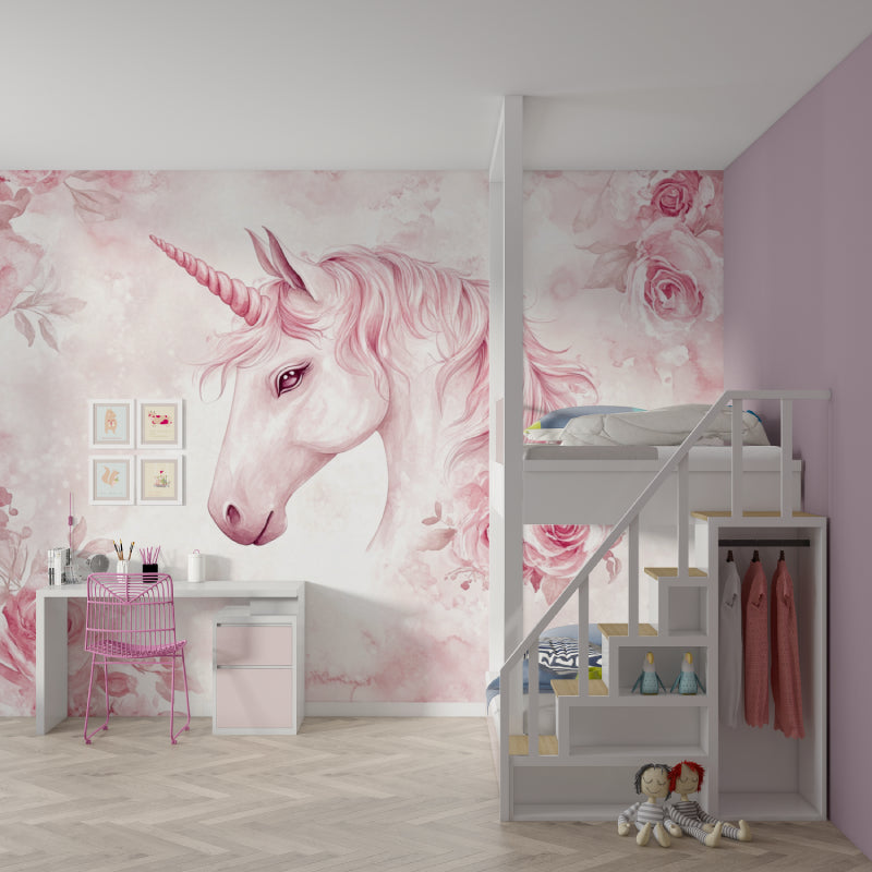 Pink unicorn wallpaper styled in a modern nursery with white furniture