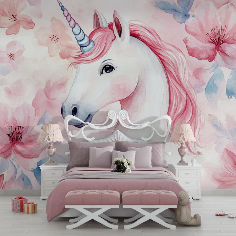 Unicorn wallpaper mural in a bright girl's bedroom with white furniture and pink accents