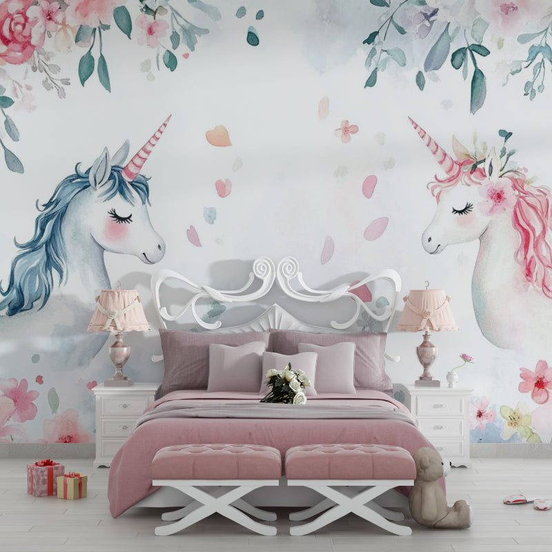 Unicorn wallpaper bringing charm to a nursery with a white crib and floating shelves