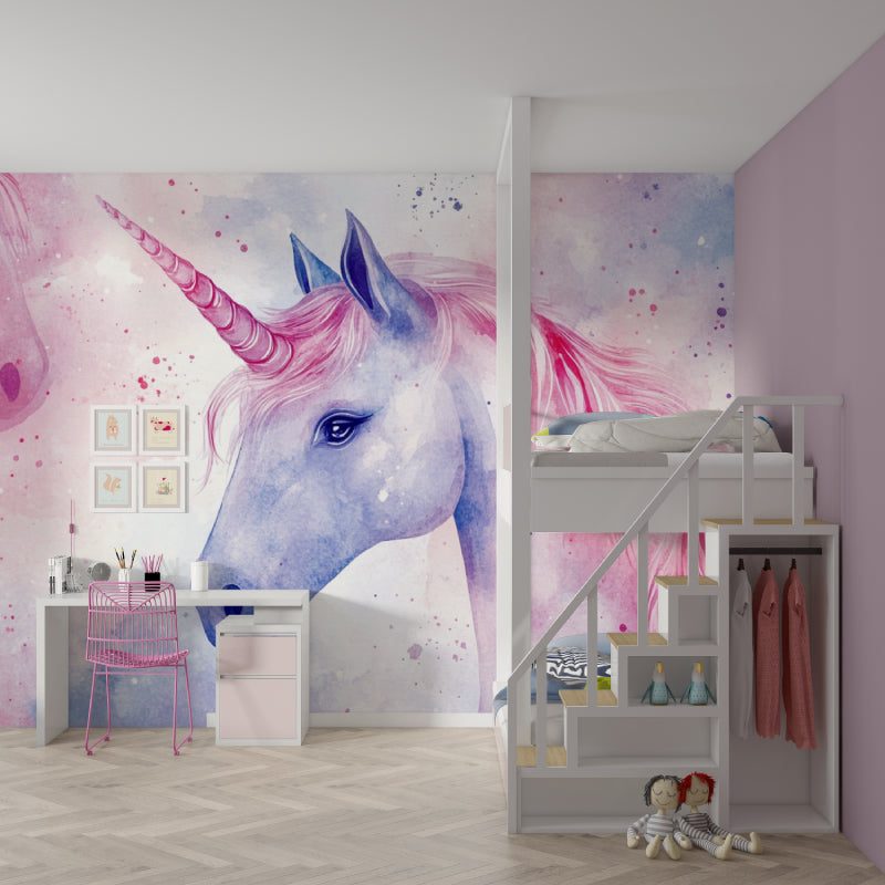 Nursery with watercolor unicorn wallpaper showing gentle pink and blue tones