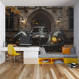 Classic car wallpaper bringing sophistication to a modern living room with black and gold accents