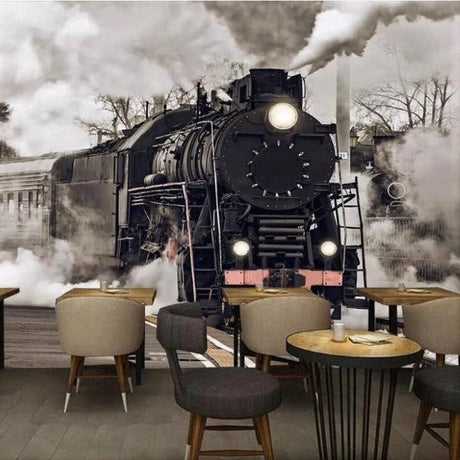 Vintage train wallpaper creating dramatic atmosphere in modern living room with dark furniture and high ceilings