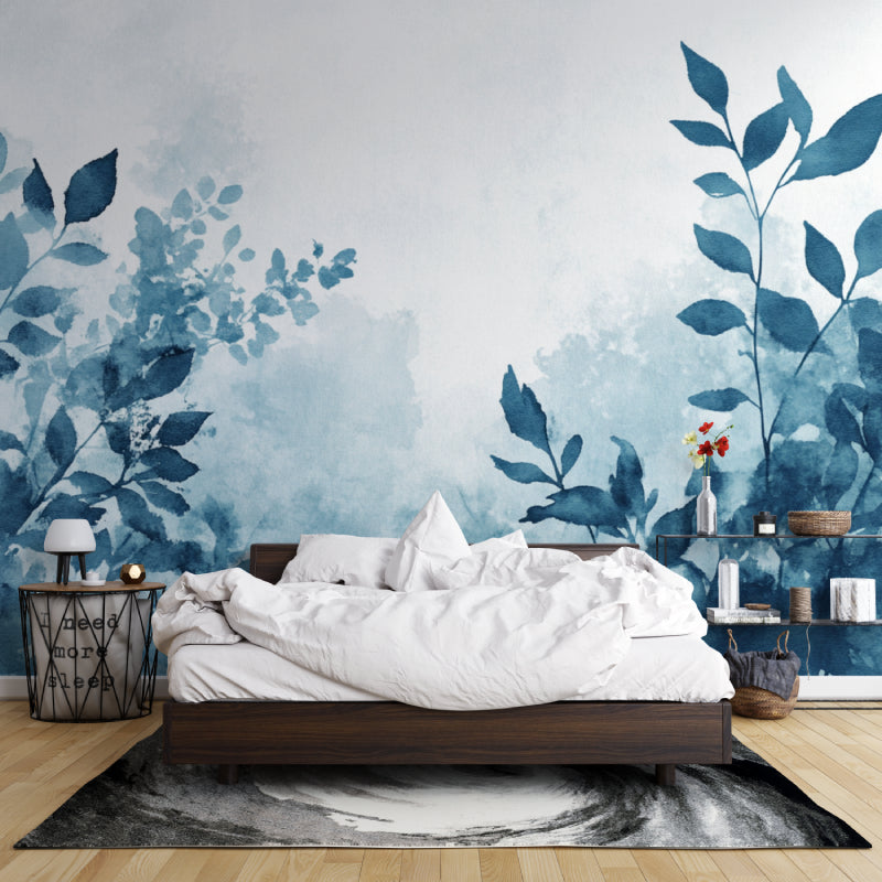 Blue botanical wallpaper creating depth in an entrance hall