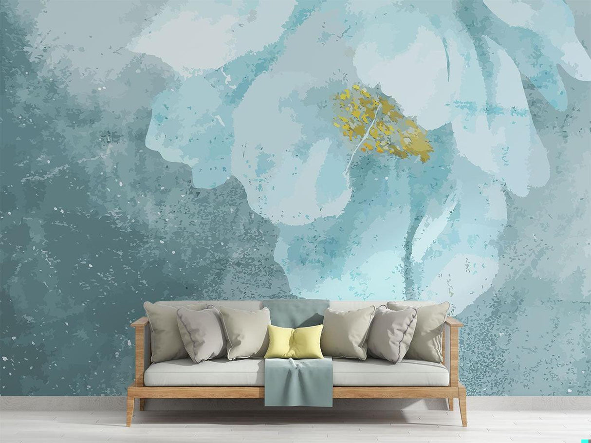 Blue and gold watercolor floral wallpaper in modern living room setting with white furniture