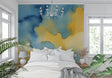Modern watercolor abstract wallpaper in bright living room, blue and yellow tones creating peaceful atmosphere