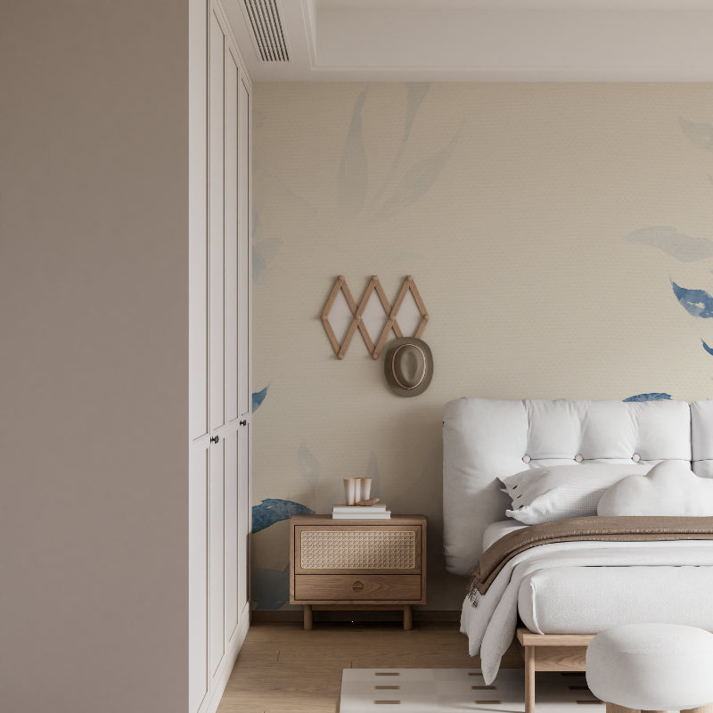Blue watercolor leaf wallpaper in bright modern living room creates serene atmosphere