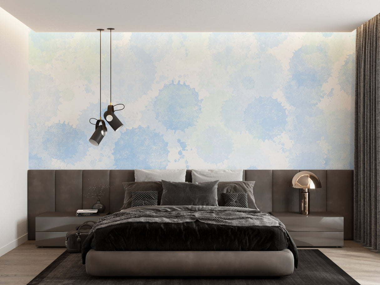 Blue cloud mural wallpaper in a minimalist bedroom setting with white furniture