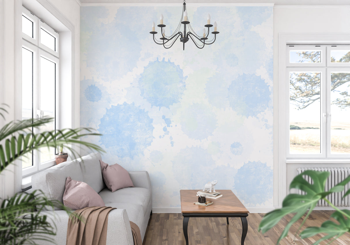 Watercolor wall mural brightening a home office with soft blue cloud patterns
