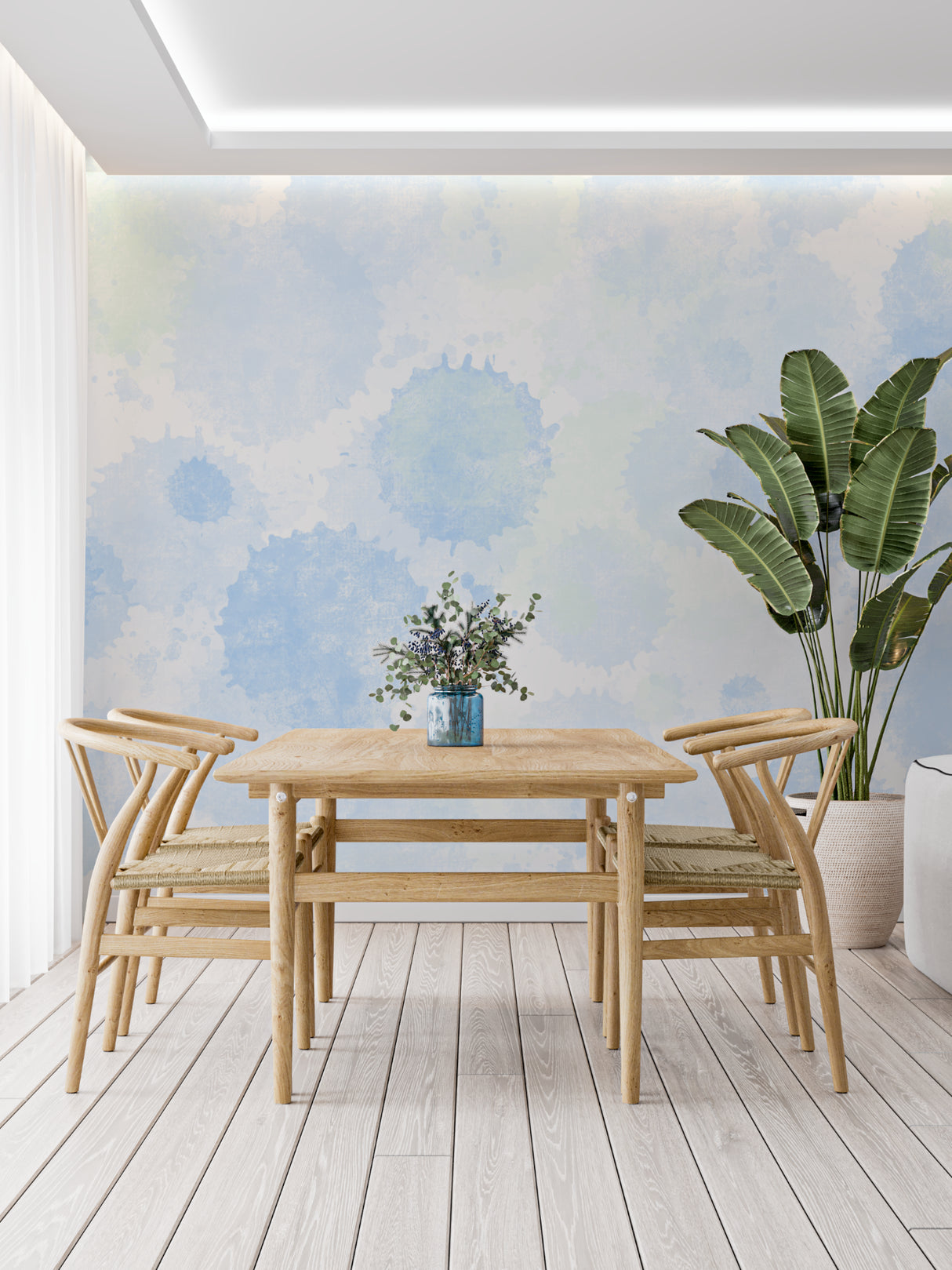 Soft blue watercolor mural making a small reading nook feel spacious