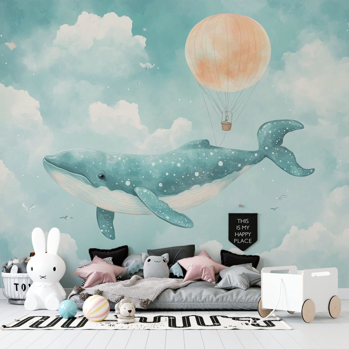Whale wallpaper mural in a cozy nursery with soft lighting and wooden furniture