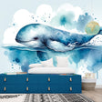 Whale mural wallpaper creating a peaceful atmosphere in a modern living room with natural light and minimal furniture