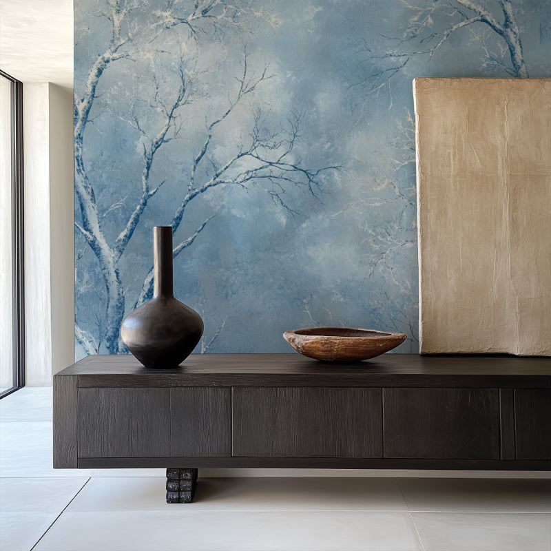 Frosty blue forest wallpaper in a cozy bedroom setting with natural light