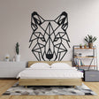Modern geometric wolf wallpaper displayed in a minimalist living room, showing bold black lines against white walls