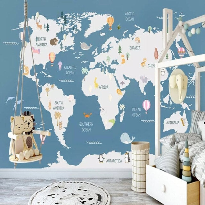 World map wall mural in nursery with gentle blue tones