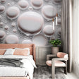Modern 3D bubble wallpaper creating depth in a bright living room, floating spheres catch natural light