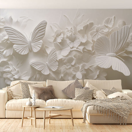 White 3D butterfly relief wallpaper creating depth in a modern living room with natural lighting highlighting the textured details