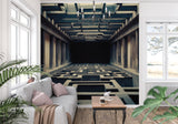 3D geometric wallpaper creating depth in modern living room with grey sofa and natural light