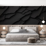 Modern living room featuring a Black 3D Abstract Wallpaper creating depth and sophistication behind a grey sofa
