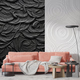Black 3D feather textured wallpaper in modern living room with natural lighting highlighting the relief pattern