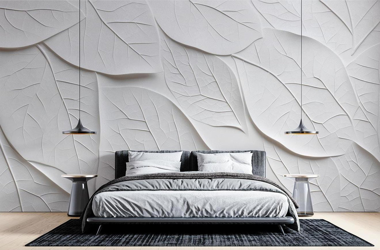White embossed 3D leaf wallpaper creating dramatic shadows in a modern living room with floor-to-ceiling windows