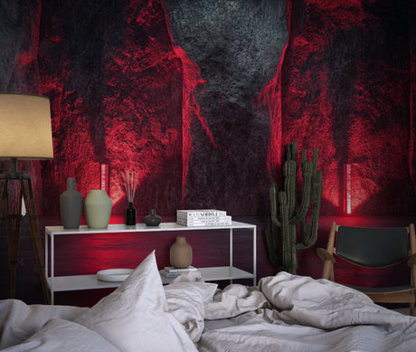 Red and black 3D stone effect wallpaper creating depth in a modern living room with minimal furniture