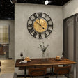 Roman Numeral Wall Clock  Black Metal With Gold Center - Product showcase