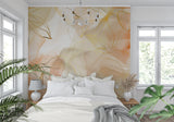 Watercolor floral wallpaper brightening a master bedroom with golden accents