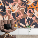 Modern abstract floral wallpaper in bright living room setting with orange and pink tones
