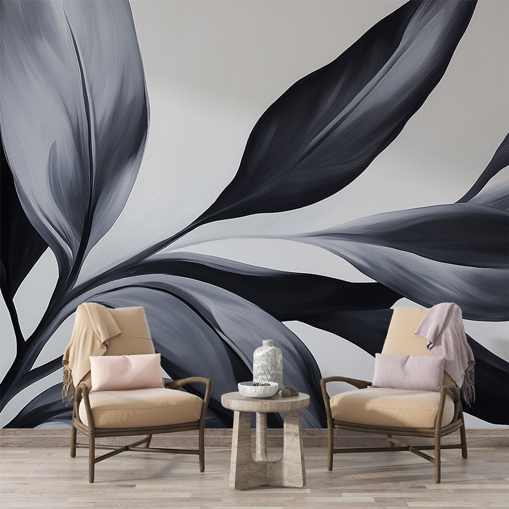 Black and white botanical wallpaper creating dramatic impact in modern living room with tall windows and minimal furniture