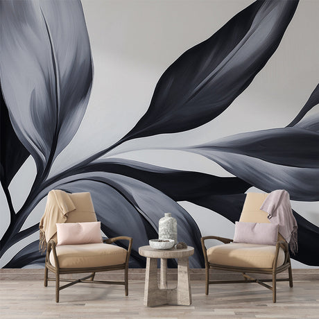 Black and white botanical wallpaper creating dramatic impact in modern living room with tall windows and minimal furniture