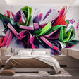 Modern 3D graffiti art wallpaper creating depth in a stylish living room with contemporary furniture and natural lighting