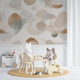 Home office space with neutral geometric wallpaper featuring golden feather accents