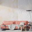 Abstract beige watercolor wallpaper with 3D circles creating depth in a modern living room setting