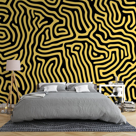 Modern living room featuring Black and Gold Geometric Maze wallpaper creating a stunning accent wall behind grey sofa