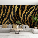 Black and gold abstract luxury wallpaper creating dramatic impact in a modern living room with high ceilings