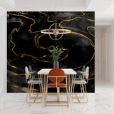 Master bedroom with black marble accent wall and gold details