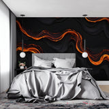 Abstract orange wave wallpaper creating drama in modern living room setting