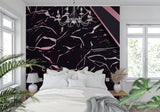 Black and pink marble wallpaper creating drama in a modern living room with minimal furniture
