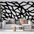 Modern Abstract Geometric Wallpaper creating dramatic impact in a minimalist living room with high ceilings