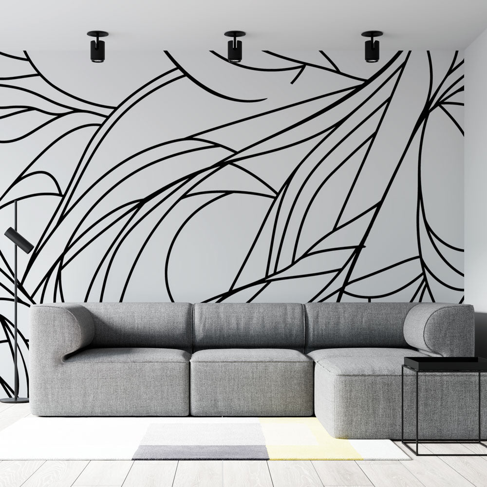 Abstract line art wallpaper creating dramatic impact in a modern living room with minimalist furniture