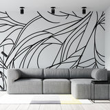 Abstract line art wallpaper creating dramatic impact in a modern living room with minimalist furniture