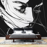 Black and white line art portrait mural wallpaper styled in a modern living room with minimal furniture