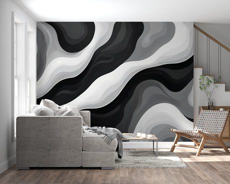 Black and white wave mural wallpaper in modern minimalist living room with grey sofa
