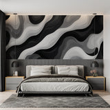 Black and white abstract wave mural in modern bedroom setting