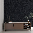 Black crocodile textured wallpaper in a modern living room setting with minimalist furniture