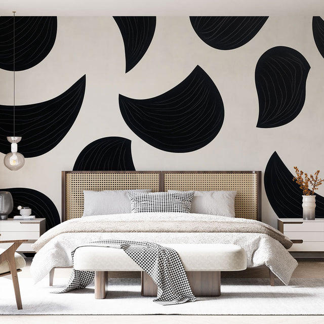Modern abstract black curved shapes wallpaper in a minimalist living room with white sofa and natural light