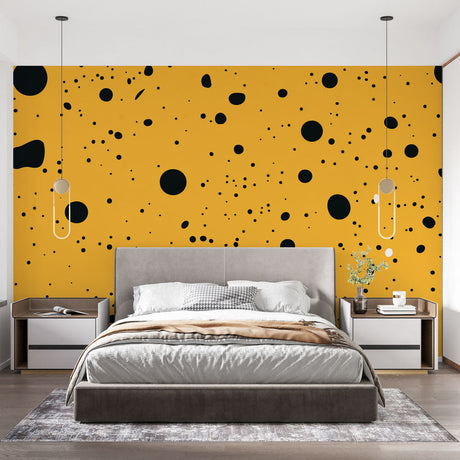 Modern home office featuring yellow and black polka dot wallpaper creating an energetic workspace atmosphere