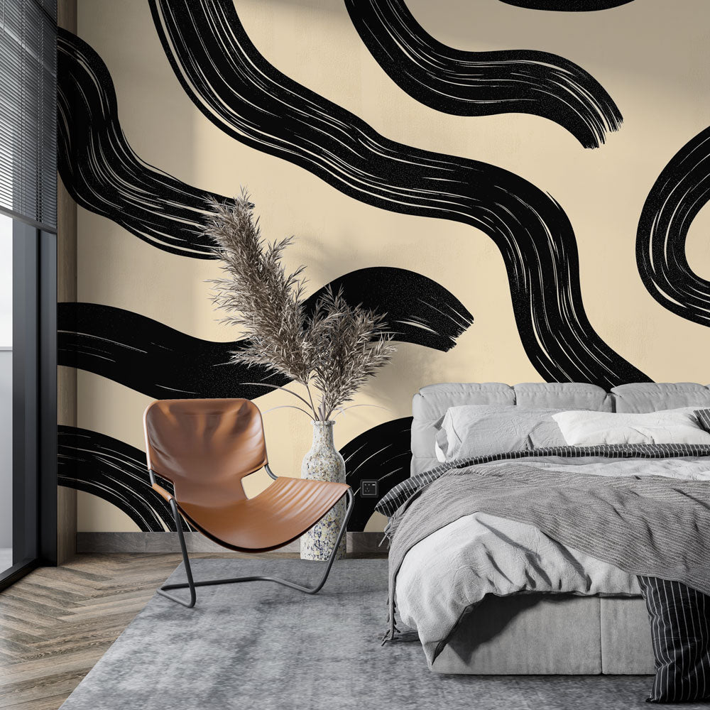 Modern abstract wave wallpaper creating dramatic impact in a minimalist living room with black and cream contrasts