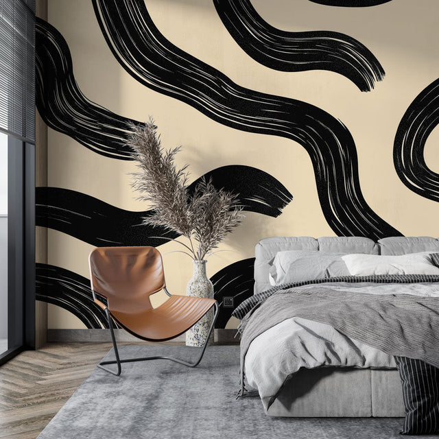 Modern abstract wave wallpaper creating dramatic impact in a minimalist living room with black and cream contrasts